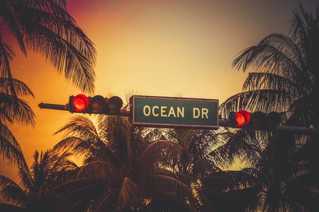 Ocean Drive sign with palm trees in Miami Beach, Florida. Vintage colors