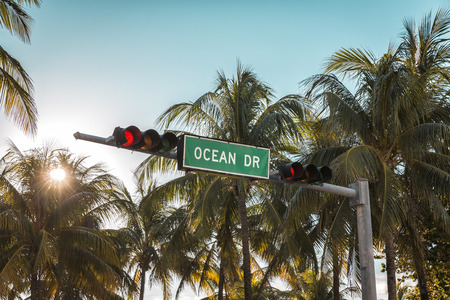 Ocean Drive sign with palm trees in Miami Beach, Florida. Vintage colors