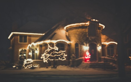 Seasonal Christmas House Lights Decoration, outdoor blurred defocused view. Xmas showcaseの写真素材