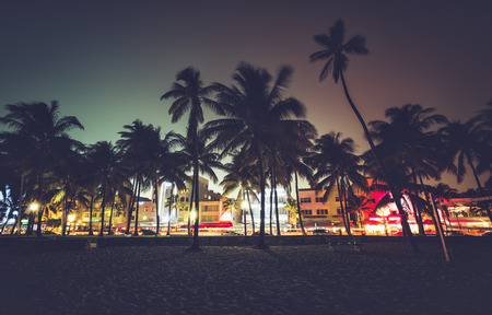 Ocean Drive street with illuminated buildings, South Beach , Florida. Vintage desaturated colorsの写真素材