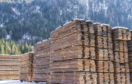 Drying timber boards at the sawmill in winter Alp Mountainsの写真素材
