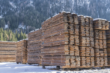 Drying timber boards at the sawmill in winter Alp Mountainsの写真素材
