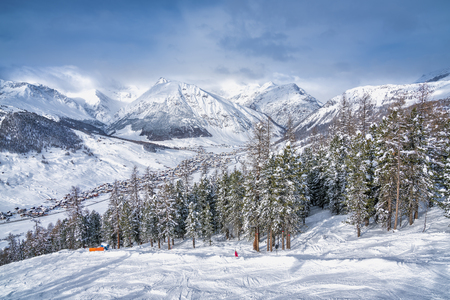Alpine Ski Resort And Ski Slopes in Winter Season, Livigno, Italyの写真素材