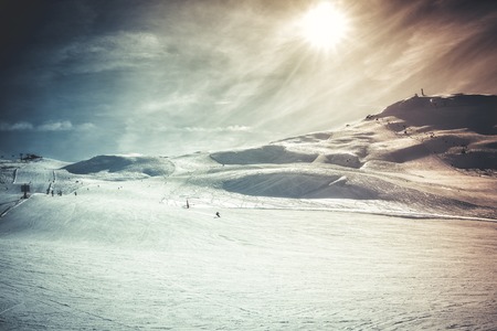 Sunny day on ski slopes, winter landscape. Vintage colorsの写真素材
