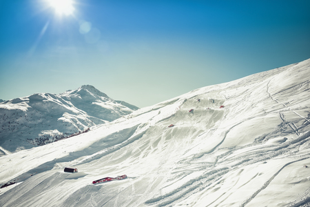 Ski slope with obstacles on sunny day. High mountains winter seasonの写真素材