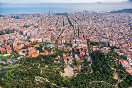 Aerial high angle view of famous Park Guell and city skyline panorama, Barcelona, Spainのeditorial素材