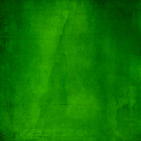 Green abstract textured background with scratchesの写真素材