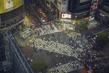 TOKYO, JAPAN - CIRCA APRIL 2017: Pedestrian scramble crosswalk in Shibuya, Tokyo at night. People crossing the street in business districtのeditorial素材