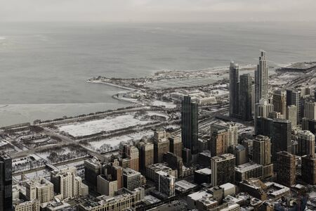 High angle view of Chicago downtown panorama in winter, frozen lake with snow on Lake Michiganの写真素材