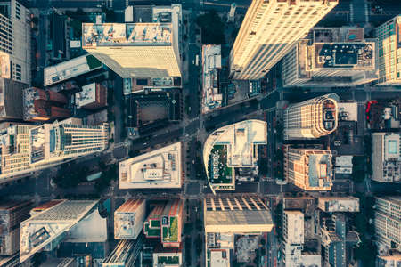 Top down aerial view of Chicago Downtown skyscrapers. Urban grid with streets and tall buildings. Late afternoon lightの写真素材