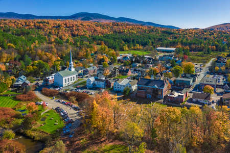 Aerial view of charming small town Stowe in Vermont. Mountains with fall multicolor treesの写真素材