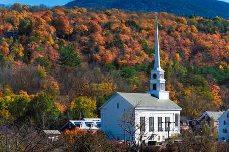 White Community Church in famous ski town of Stowe in Vermont at fallの写真素材