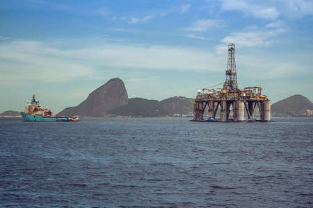 Gas and oil offshore rig platform on the sea with panorama of Rio de Janeiro, Brazilの写真素材