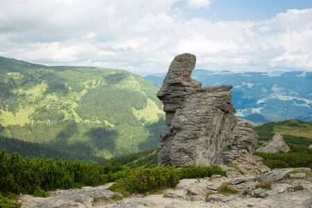 Rock Mountains against Cloudy Blue Sky on Backgroundの写真素材