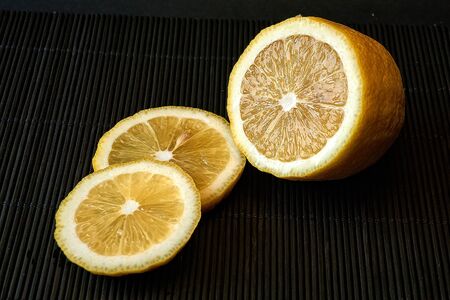 Sliced lemon on a dark backgroundの写真素材