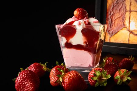 Strawberry dessert with strawberries on a black backgroundの写真素材