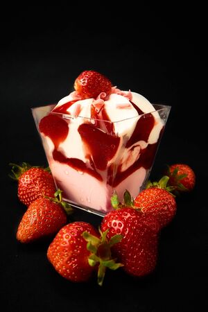 Strawberry dessert with strawberries on a black backgroundの写真素材
