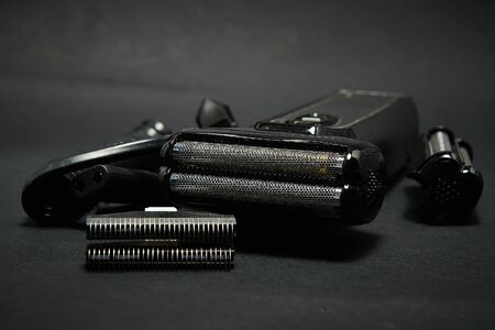 Rechargeable electric shaver for men, black backgroundの写真素材