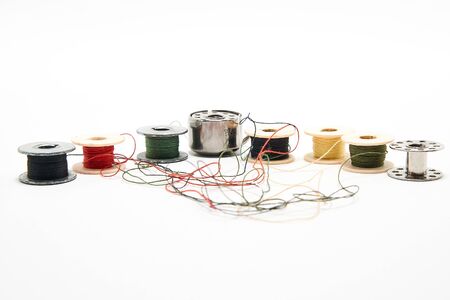 Spools of thread for a sewing machine on a white background