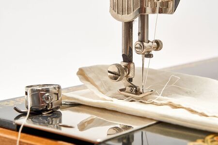 Sewing machine and parts on a white background