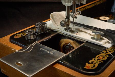 Sewing machine and parts on a dark background