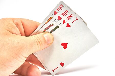 Playing cards in hand isolated on white background