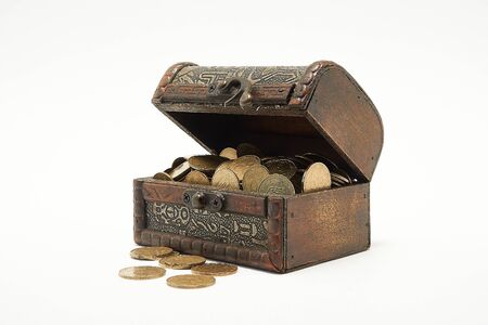 Chest with coins on a white backgroundの写真素材