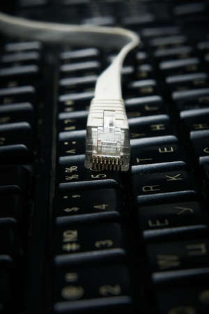 Network cable on keyboard, internet, worldwide network