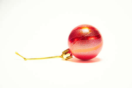Red Christmas ball on a white background, New Year, Christmas toys, holiday, Christmasの写真素材