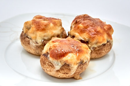 Champignons stuffed with cheese, chicken baked in the oven.の写真素材