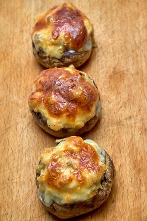 Champignons stuffed with cheese, chicken baked in the oven.の写真素材