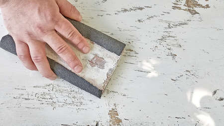 Hand sanding wood, top view.の写真素材