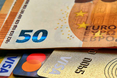 Ukraine - April 2022: Plastic cards and money, 50 euro paper banknoteのeditorial素材