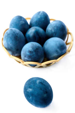 Blue painted eggs on a white background, vertical shot.の写真素材