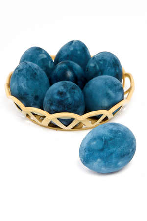 Blue painted eggs on a white background, vertical shot.の写真素材