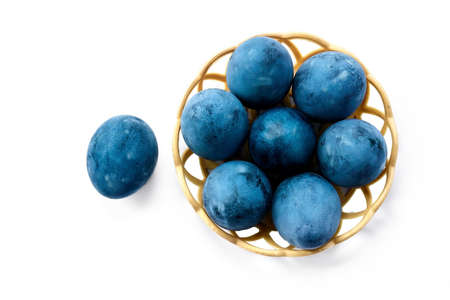 Blue painted eggs on a white background.の写真素材