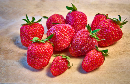 Fresh ripe organic strawberries on a wooden background.の写真素材