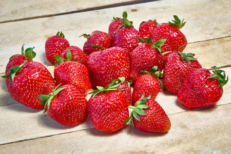 Fresh ripe organic strawberries on a wooden background.の写真素材