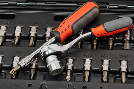 Bit set, screwdriver, wrench in a plastic case