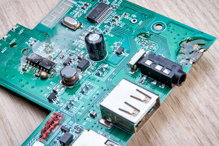 Unprofessional repair of the electrical board of the device, poorly executed repair work, poor quality soldering, solder residue, damage to components during soldering, unprofessional repair.の写真素材