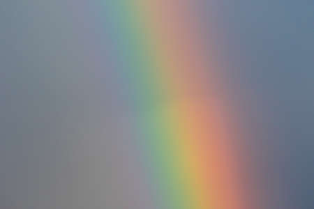 multicolored sun beam on a dark cloudy dayの写真素材