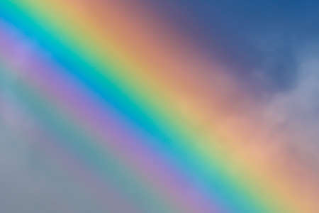 multicolored sun beam on a dark cloudy dayの写真素材