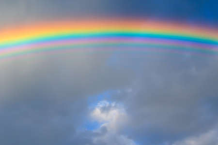 multicolored sun beam on a dark cloudy day