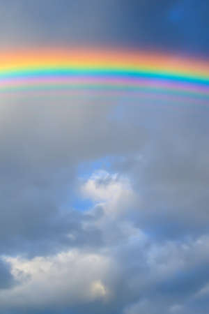 multicolored sun beam on a dark cloudy dayの写真素材