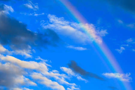 multicolored sun beam on a dark cloudy dayの写真素材