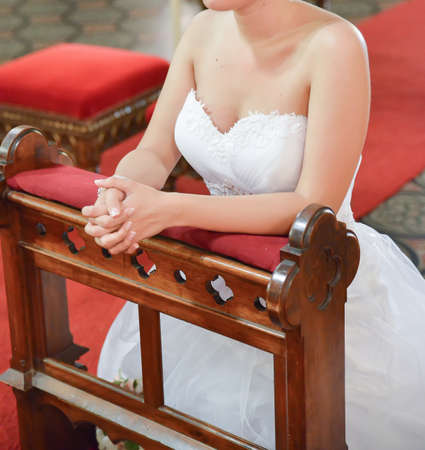 portrait of a bride wearing a white dress at the religious wedding ceremonyの写真素材