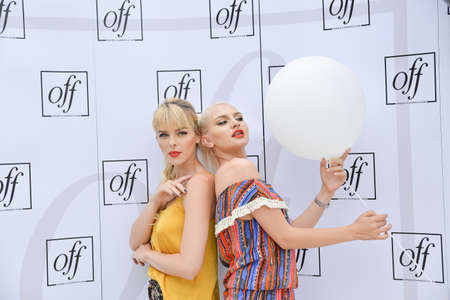 TIMISOARA, ROMANIA - June 24, 2018: Public charity event called Opera Fashion Fair. Backstage moments, portraits of beautiful blonde modelsのeditorial素材