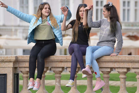 TIMISOARA, ROMANIA - March 15, 2018, Piata Unirii square: a group of teenagers are posing on the...
