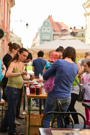 TIMISOARA, ROMANIA - April 27, 2013: People participating at the free market exchange event hold in the city centerのeditorial素材