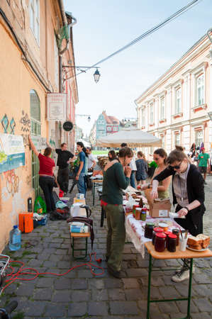 TIMISOARA, ROMANIA - April 27, 2013: People participating at the free market exchange event hold in the city centerのeditorial素材